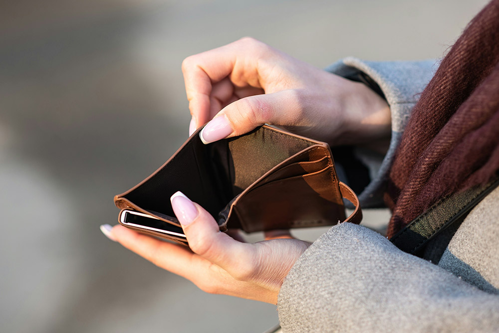 person opening a wallet